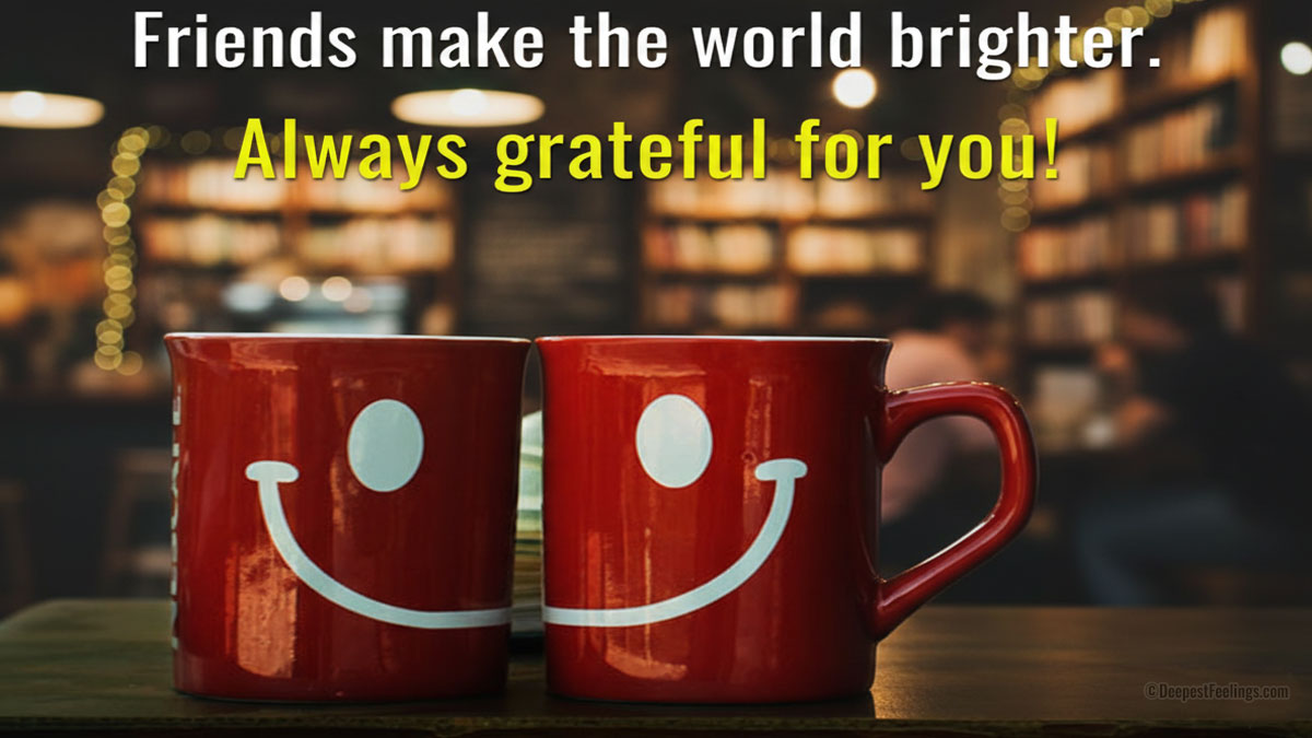 Two red mugs with a shared smiley face design on a wooden table, representing a friendship greeting card theme in a cozy library cafe