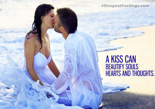 A kiss card themed with a background of a couple kissing each other in a sea beach